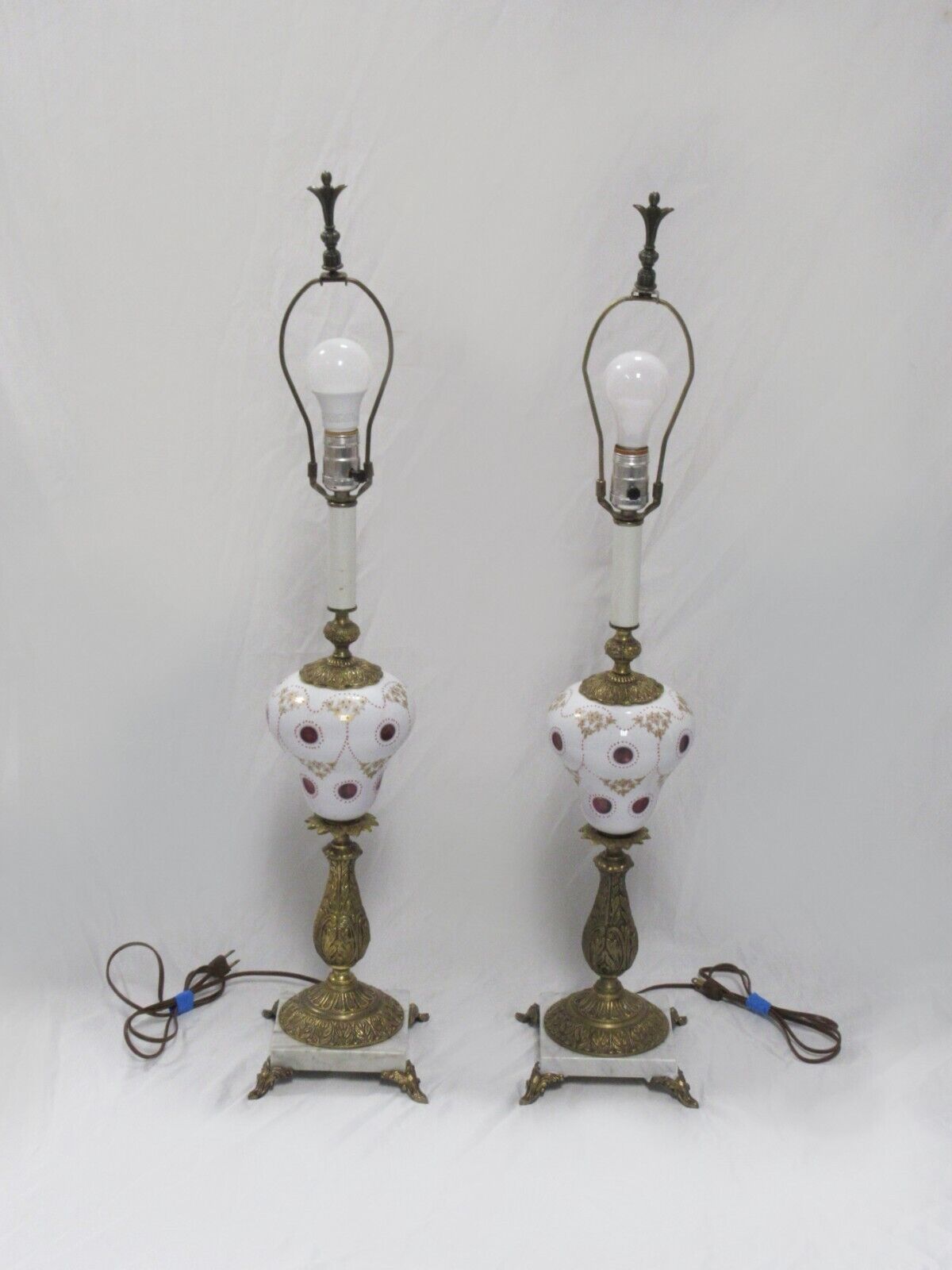 PAIR OF BOHEMIAN ENAMELED & GILDED WHITE CUT TO CRANBERRY GLASS LAMPS