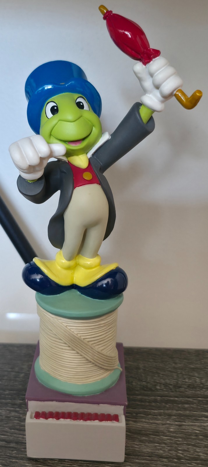 Disney Pinocchio Jiminy Cricket Figurine on Top of a Spool of Thread & Matchbox
