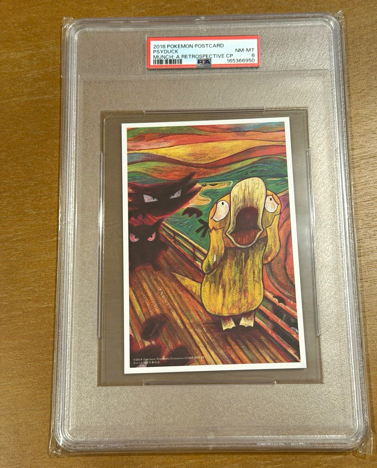 2018 POKEMON MUNCH: A RETROSPECTIVE CAMPAIGN POSTCARD PSYDUCK PSA 8