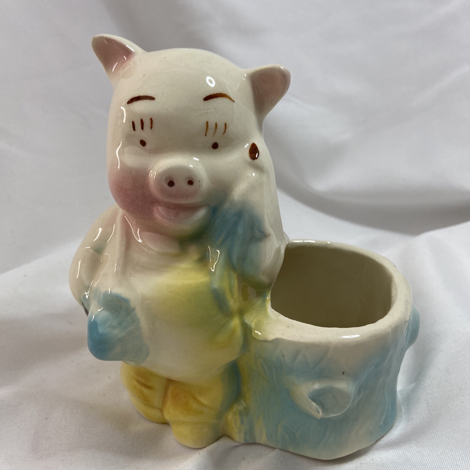 VINTAGE PIG FARMER RESTING ON TREE STUMP PLANTER ART POTTERY