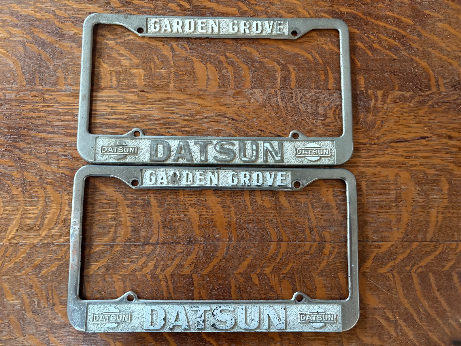 Vintage Pair of Garden Grove California Datsun Dealership License Plate Frames