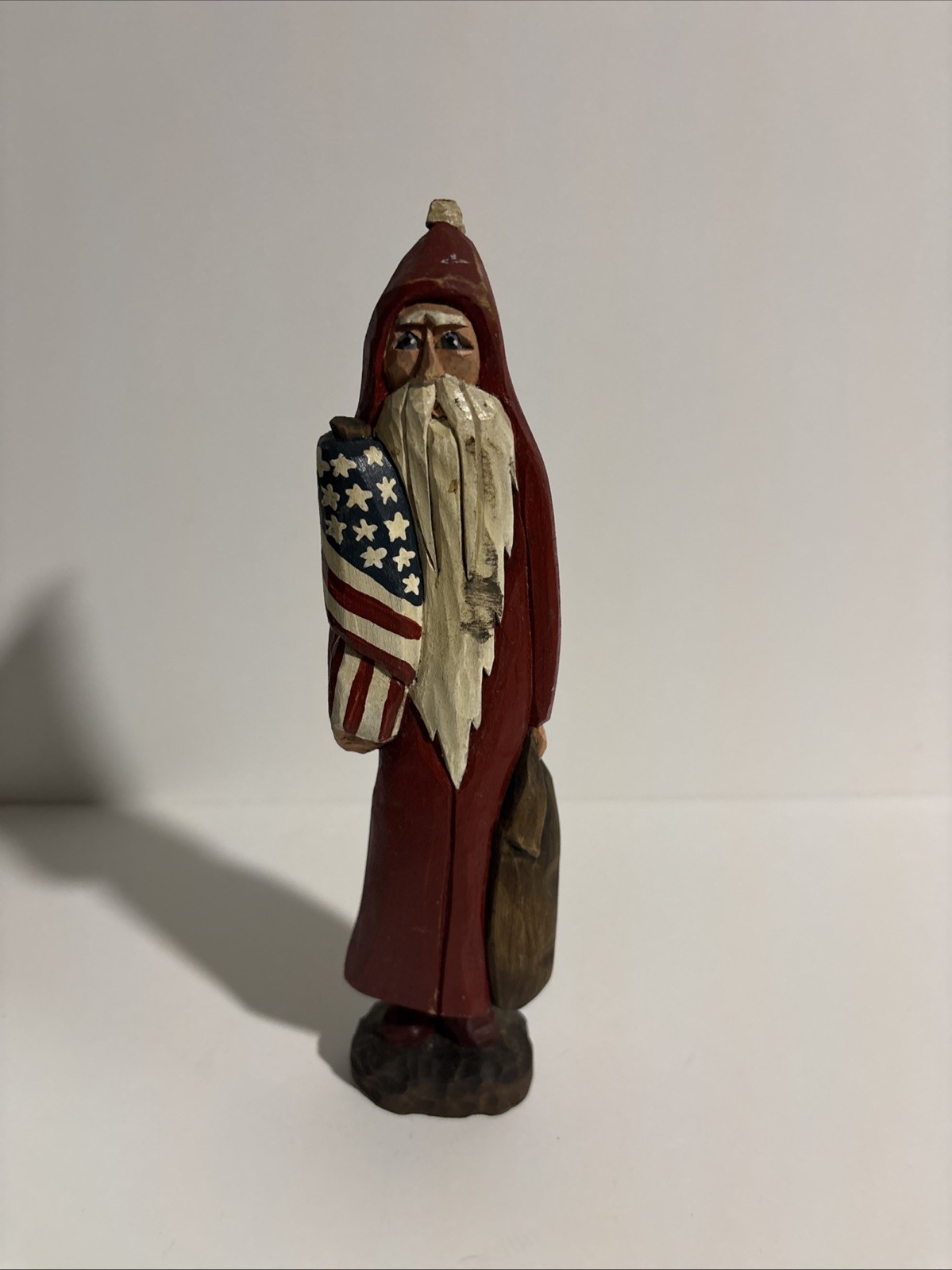 hand-carved and hand-painted wooden folk art Santa Claus figurine