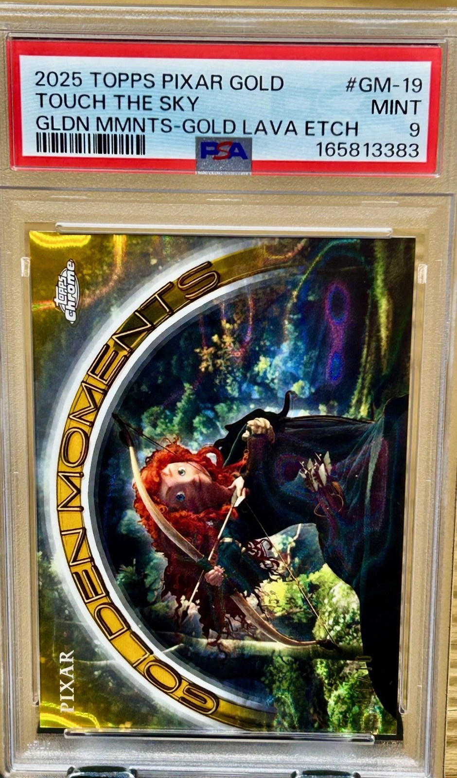 2025 Topps Pixar Gold Touch The Sky Gold Lava Merida Brave 01/10 Alpha PSA 9
