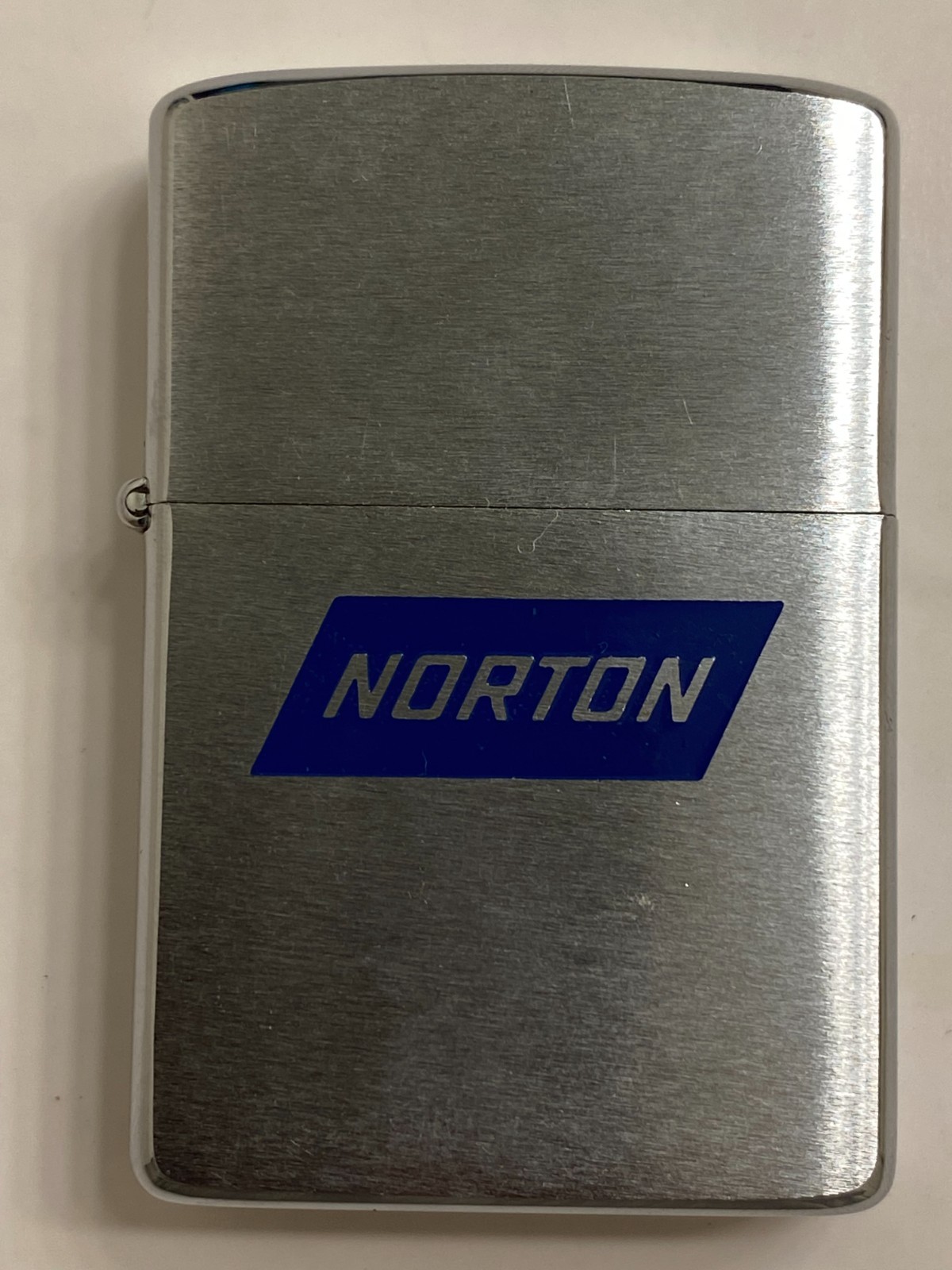 Vintage 1981 Norton Abrasives Blue Banner Logo Advertising Zippo Lighter