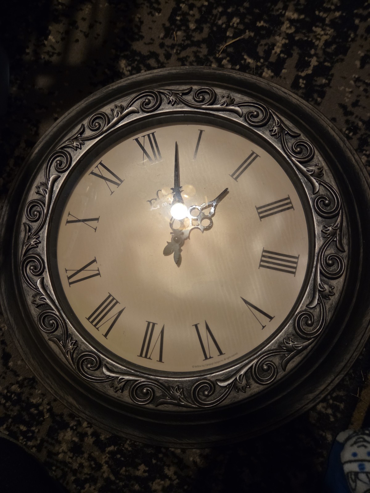The clock features an antique-style finish with a highly detailed, ornate...