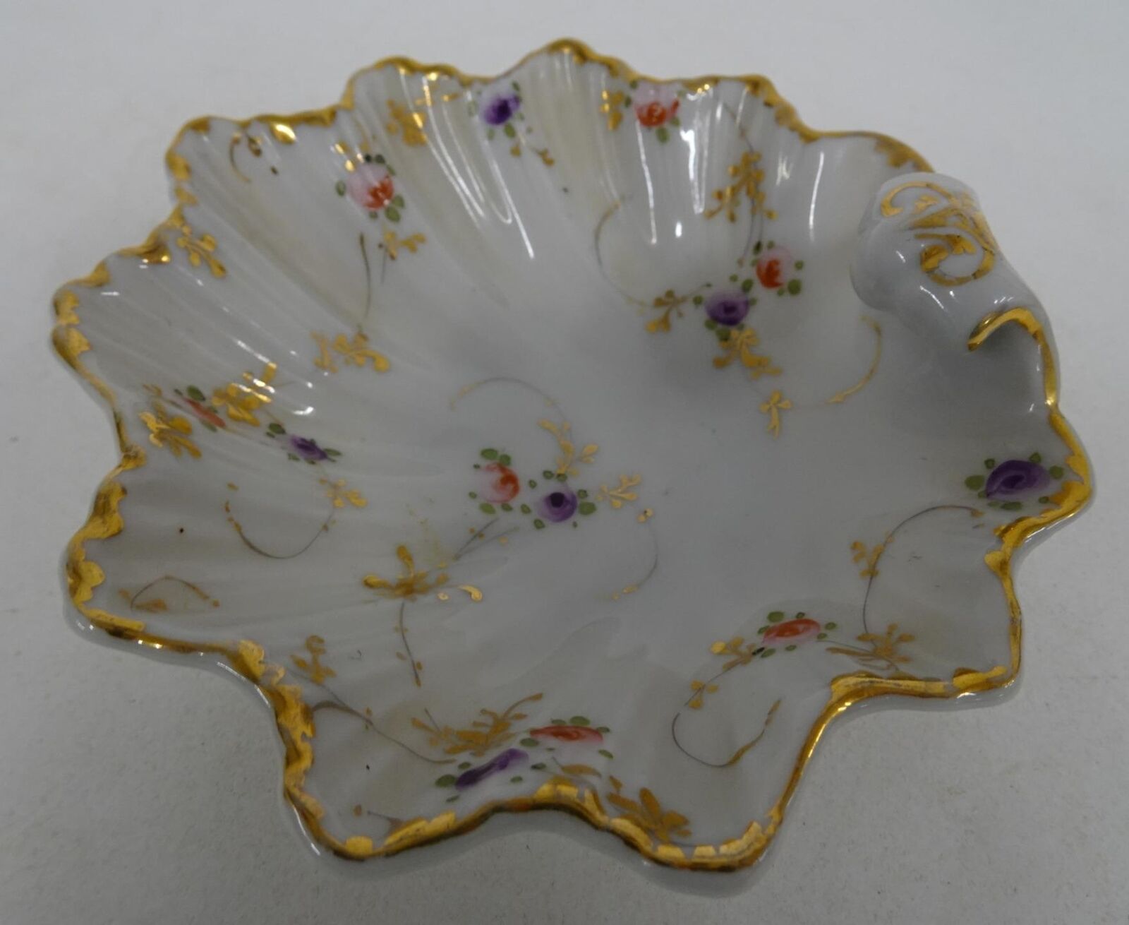 Porcelain Gilded Scalloped Trinket Dish w Curled Handle Floral Design