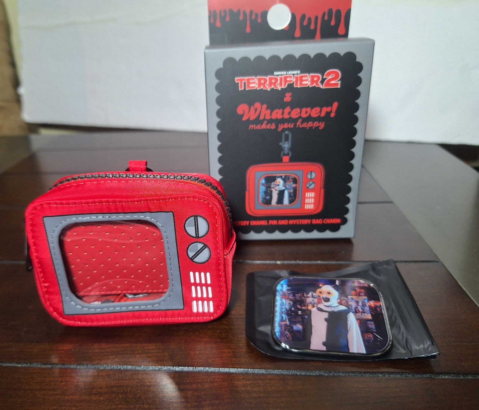 Terrifier 2 “Whatever Makes You Happy” Mystery Enamel Pin & Bag Charm Set