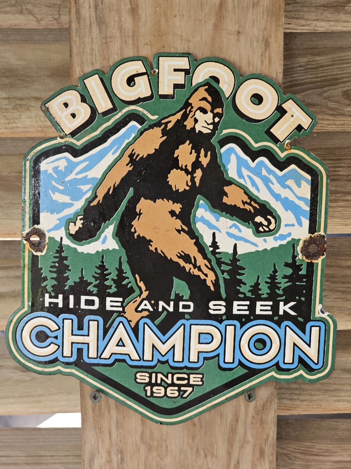 VINTAGE 1967 BIGFOOT HIDE N SEEK WILDLIFE  PORCELAIN SIGN  