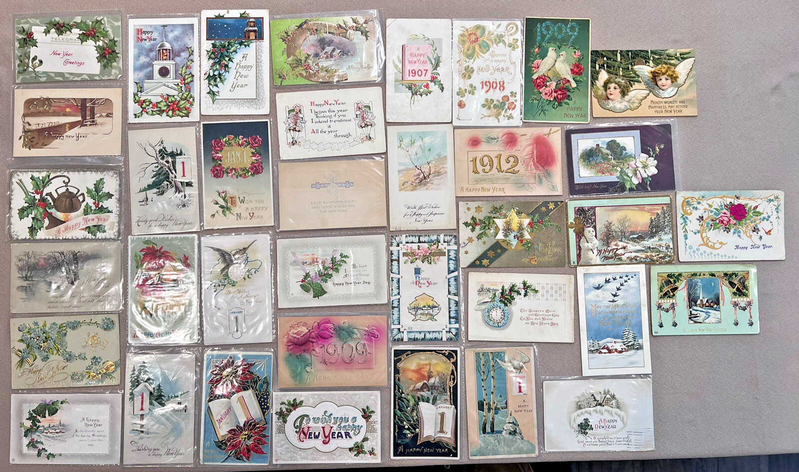 ANTIQUE LOT OF 37 NEW YEAR GREETINGS POSTCARDS FROM THE EARLY 1900'S - A900
