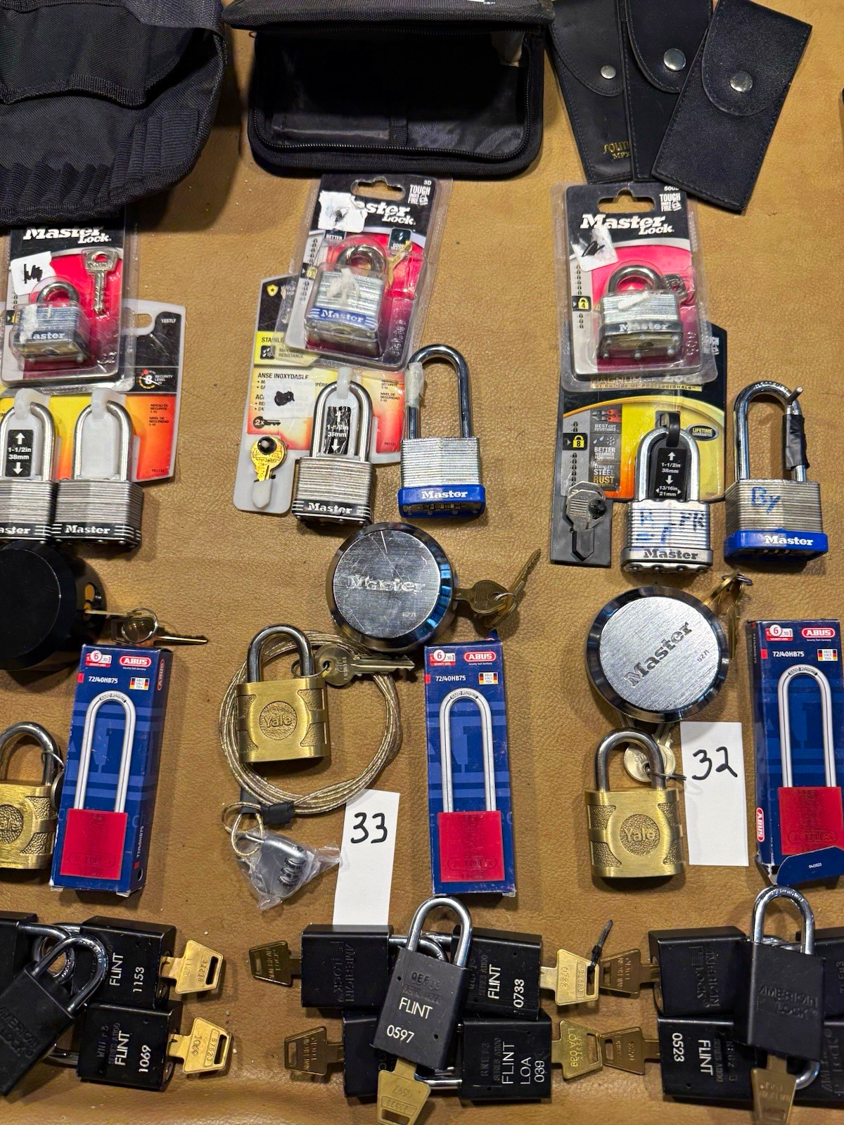 FAJARDO LOCKS- LOT 33- LOT OF PADLOCKS, LOCKS AND A CASE (PLEASE) FAJARDO LOCKS- LOT 33- LOT OF PADLOCKS, LOCKS AND A CASE (PLEASE)