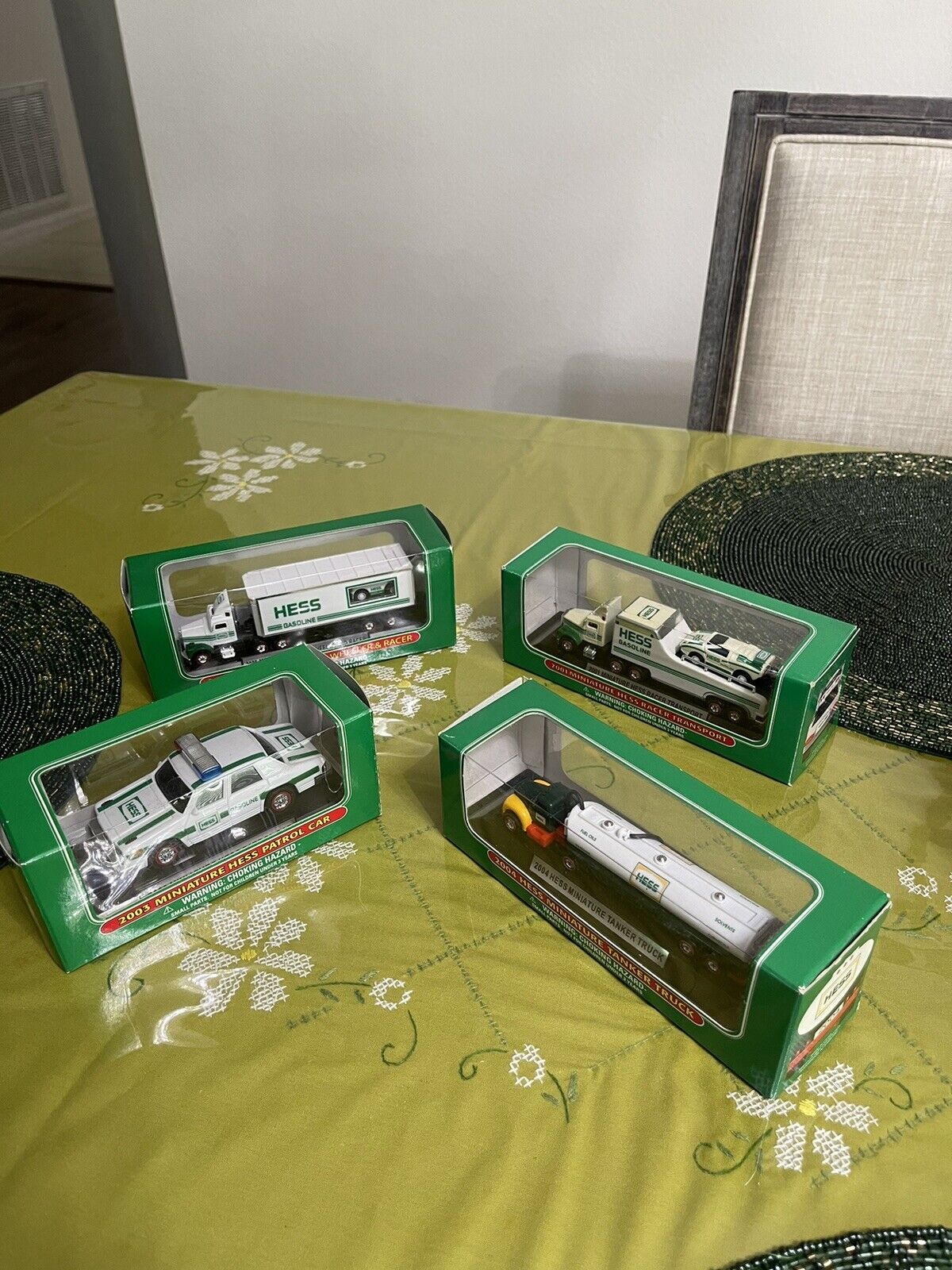 A lot of four hess miniature collectibles