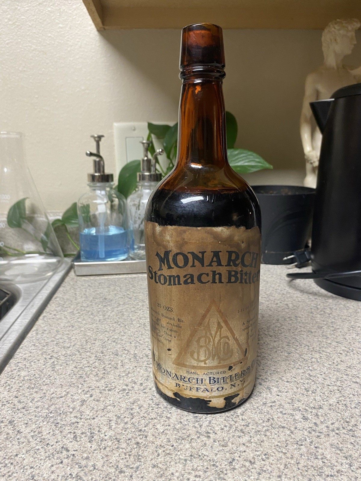 Antique Monarch Stomach Bitters Bottle Full Original Label Amber Apothecary