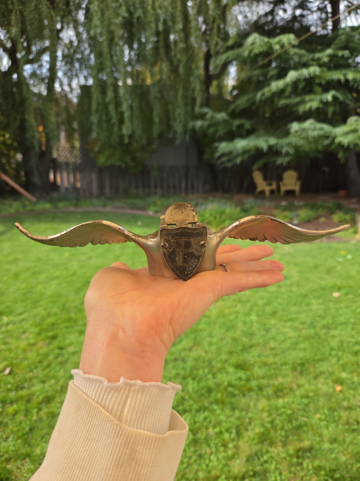 vintage 1920s-era brass winged radiator cap and hood ornament, With A P Or F