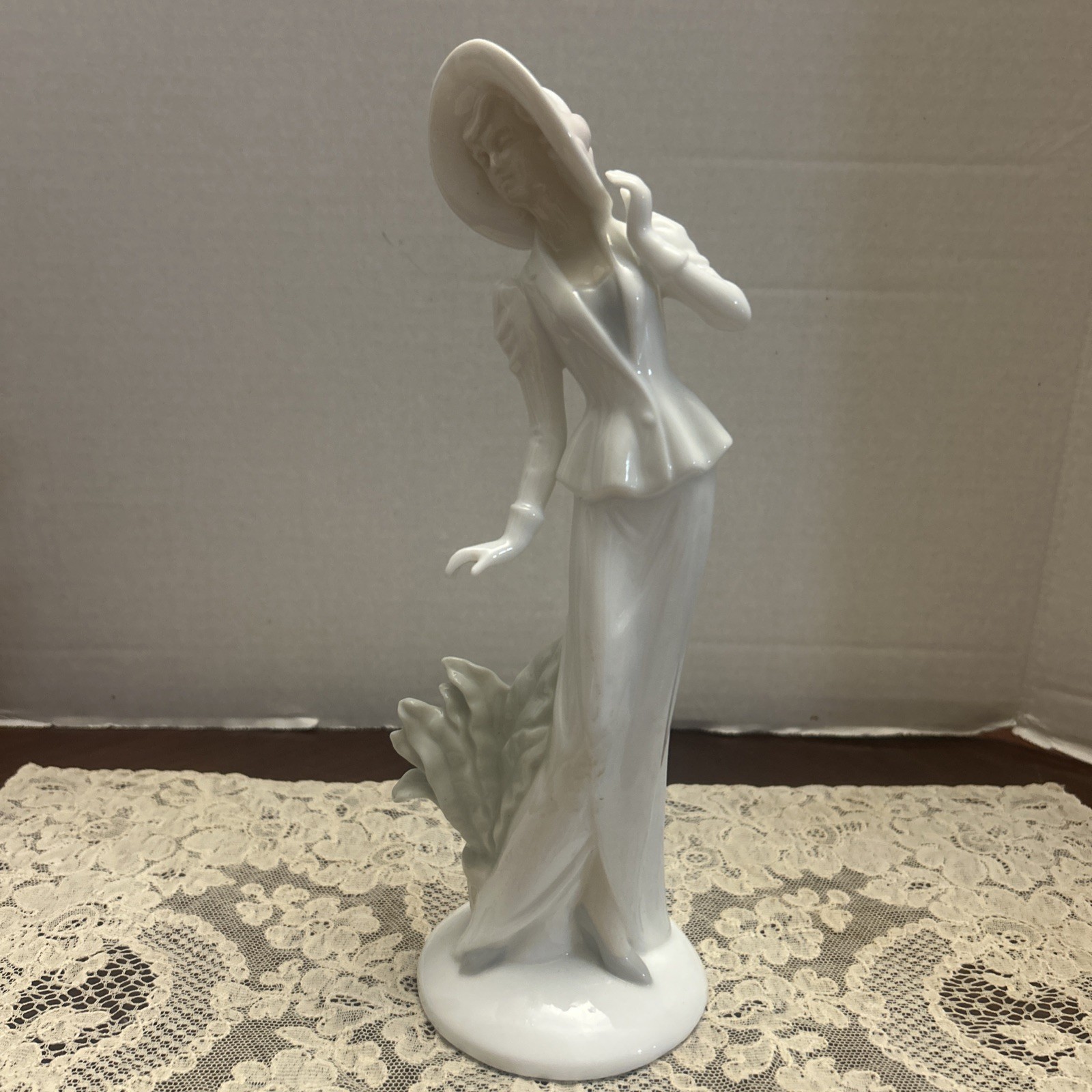 Elegant leaning Lady Ceramic Figurine