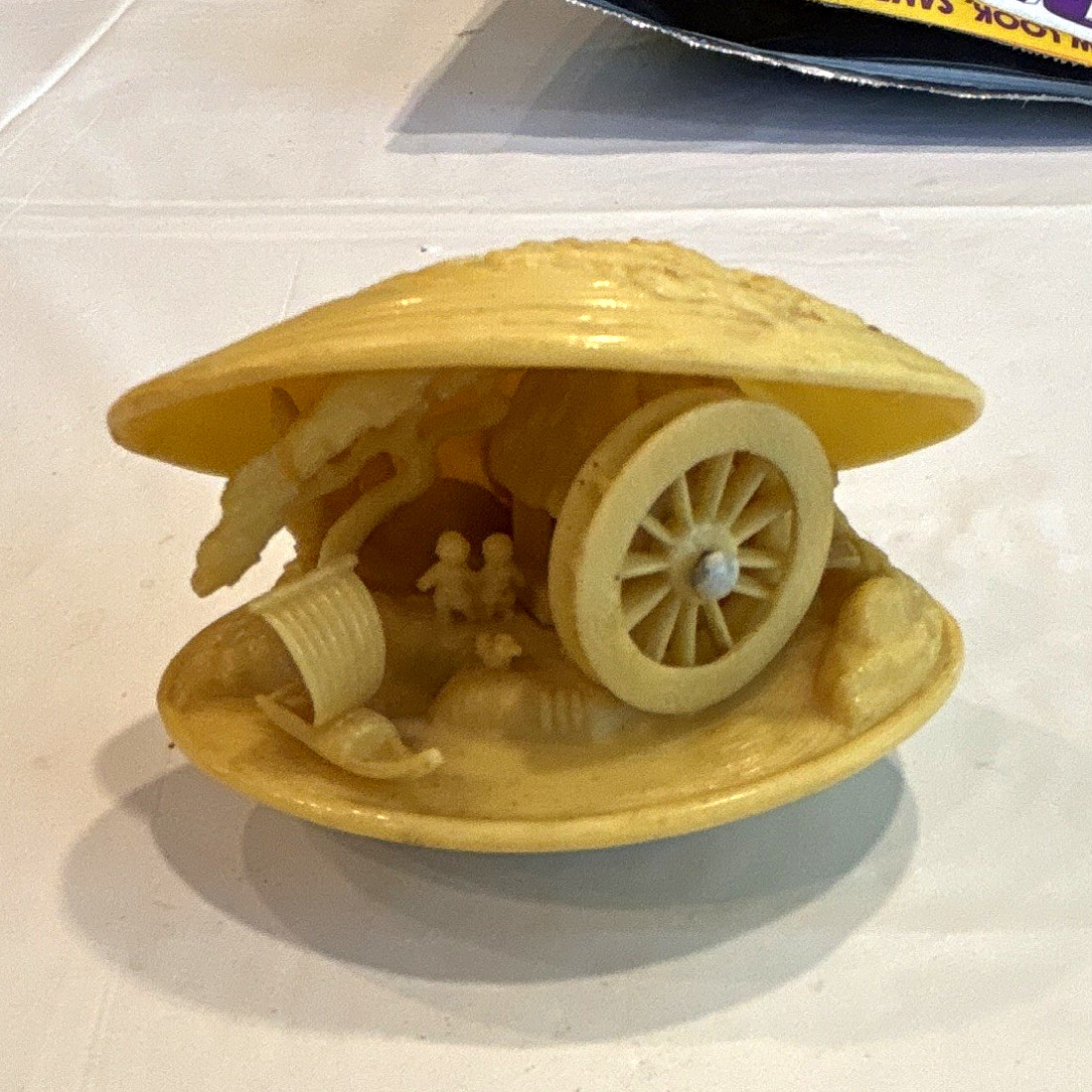 Vintage Japanese celluloid clam shell diorama.  Village scene, water wheel spins