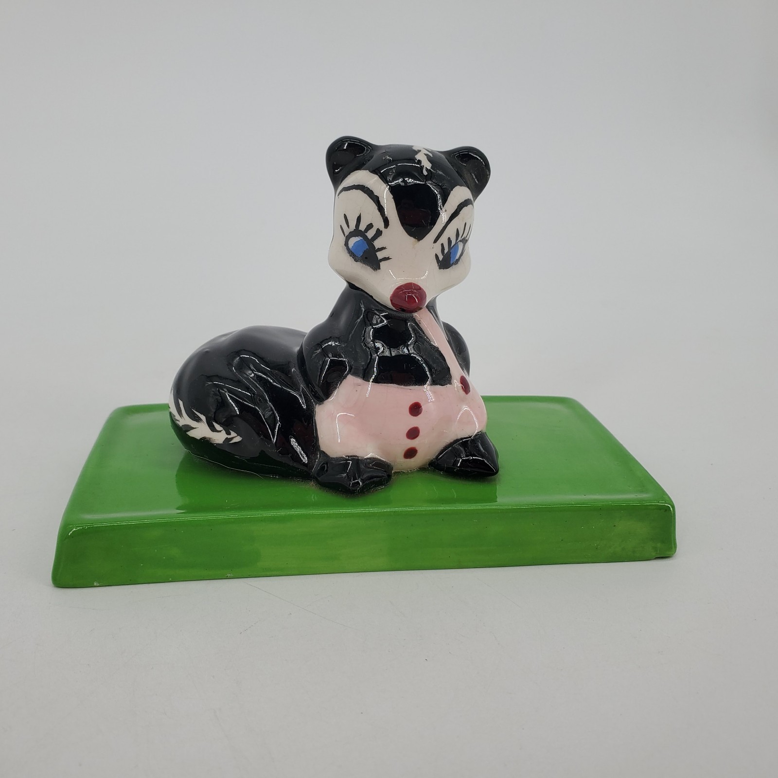Vintage MCM Anthropomorphic Ceramic Skunk Figurine On Green Platform 1972 
