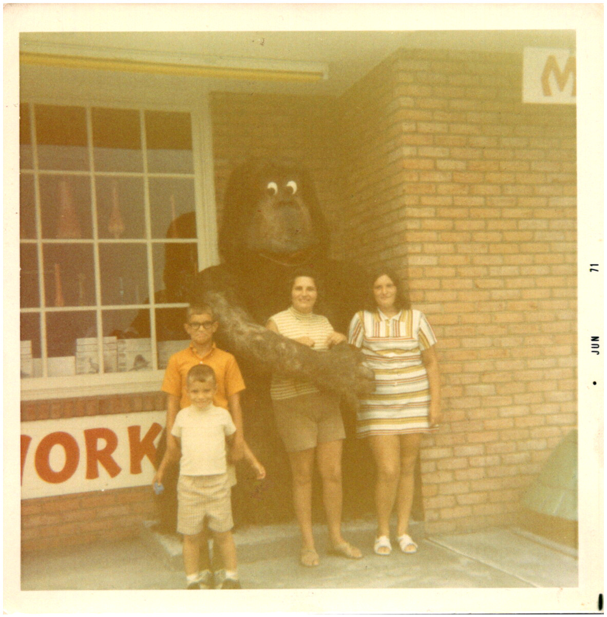 Family Posing with Gorilla Mascot Statue at Unknown Store 1971 Vintage Photo