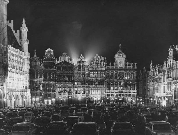 The Grand Place in Brussels filled with cars at night circa 1960 Old Photo