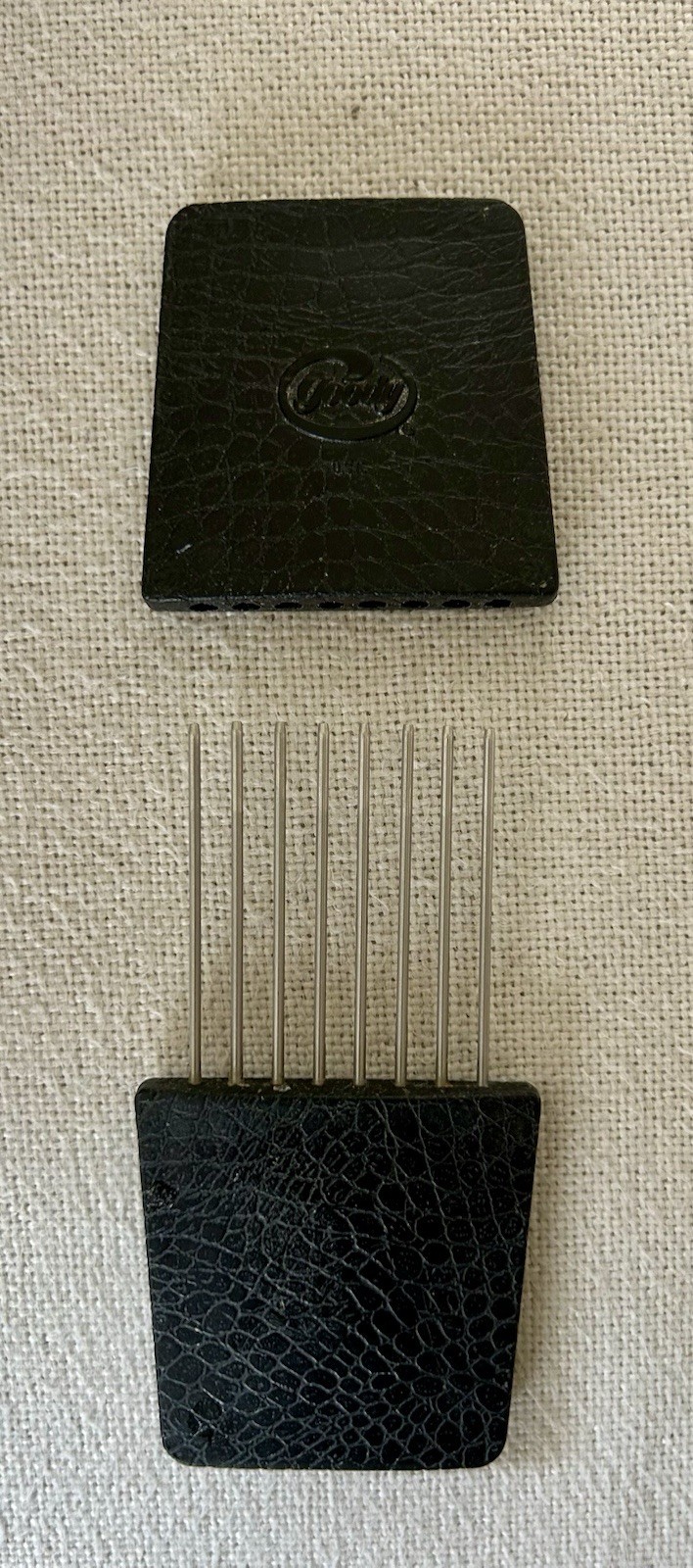 This item is a vintage Goody travel hair pick featuring a protective slipcover. This item is a vintage Goody travel hair pick featuring a protective slipcover.