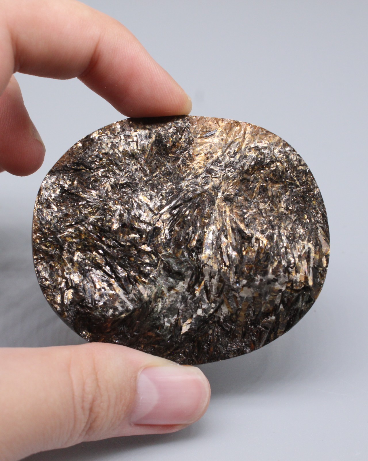 Large Golden Astrophyllite cabochon with rough surface, Kola Peninsula 61x50 mm