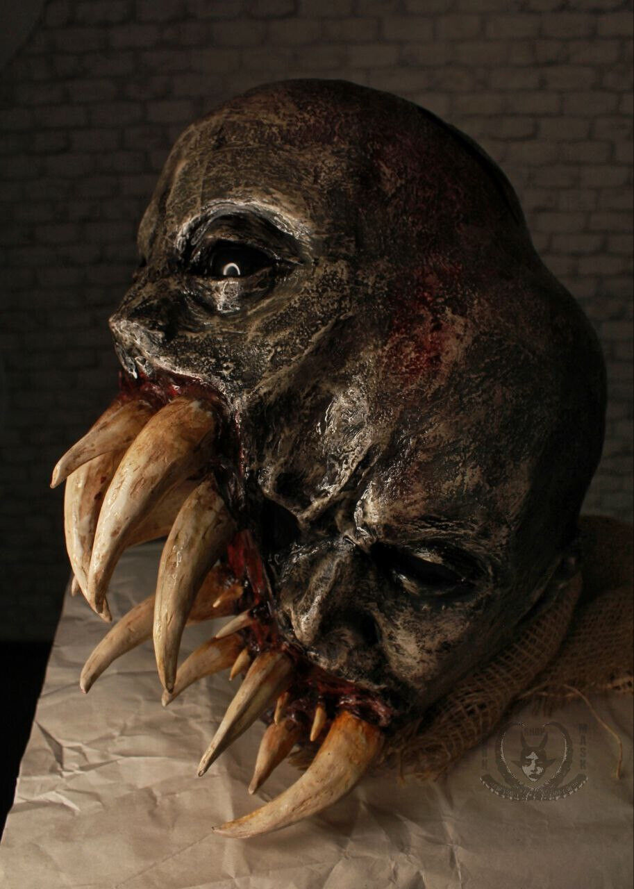 A scary two-headed toothy mutant mask with two faces