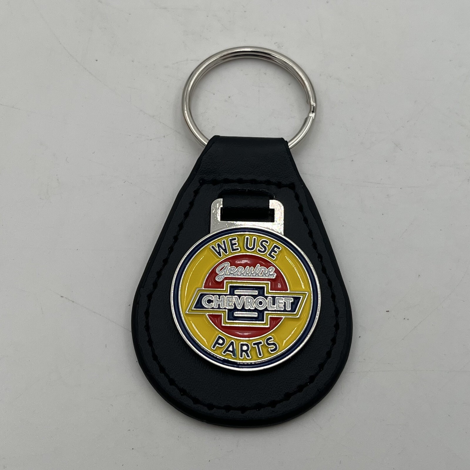 We Use Genuine CHEVROLET Parts VTG Style Sign METAL Enamel Leather KEYCHAIN Fob