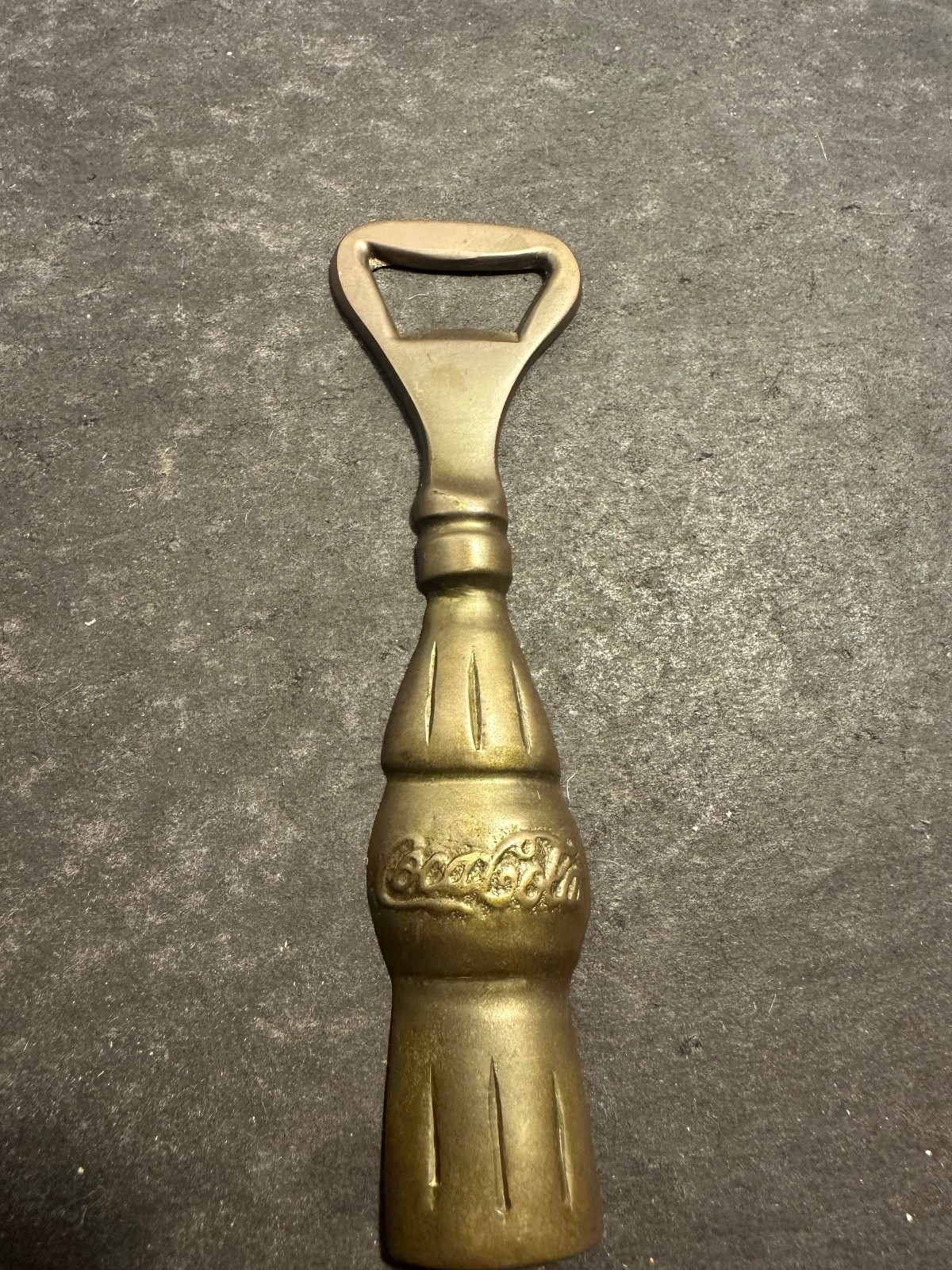 Vintage Coca Cola bottle shaped opener brass tone Made in India 5.25 in