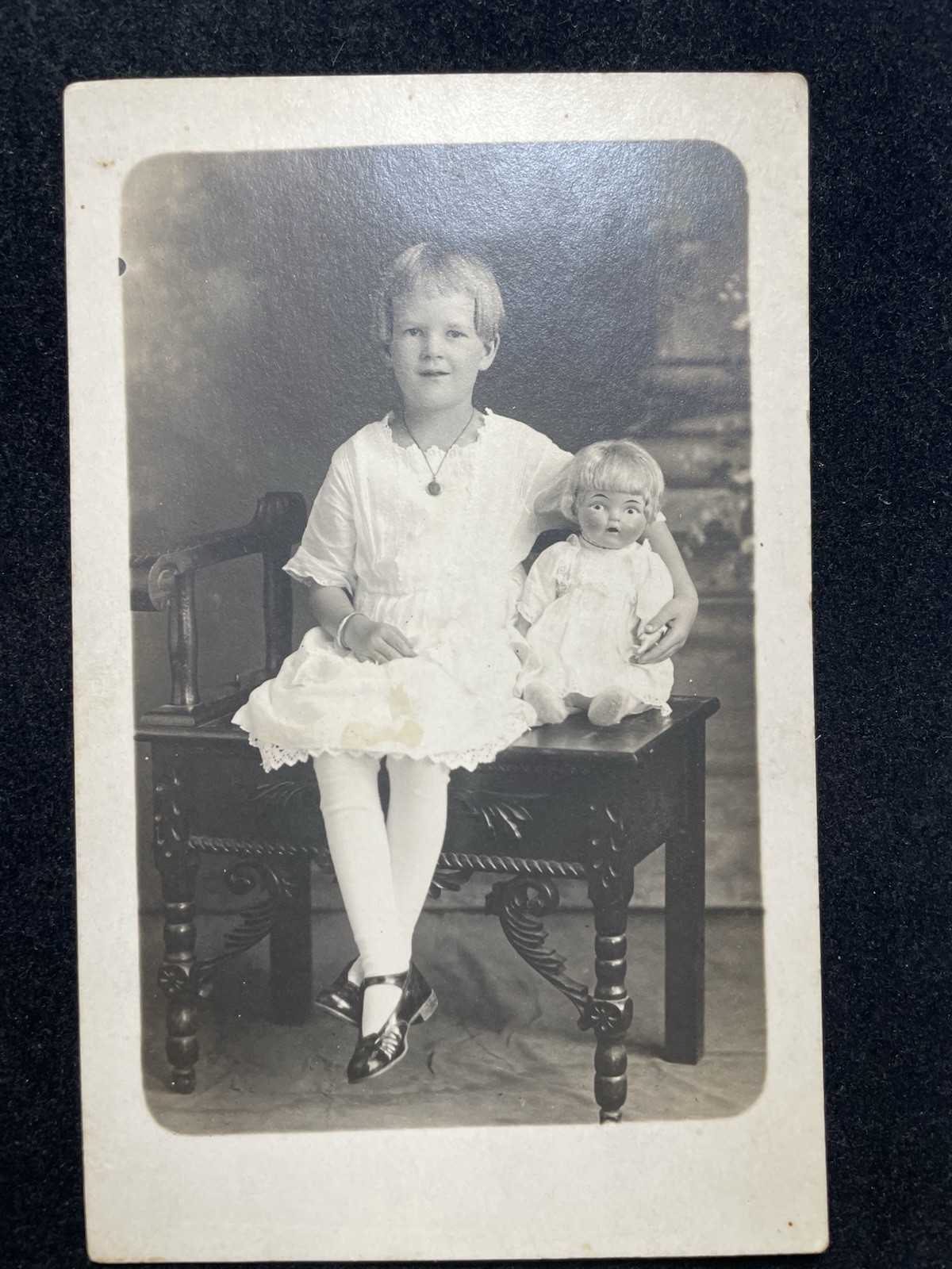 VINTAGE REAL PHOTO POSTCARD YOUNG GIRL WITH DOLL SAME HAIRSTYLE P120