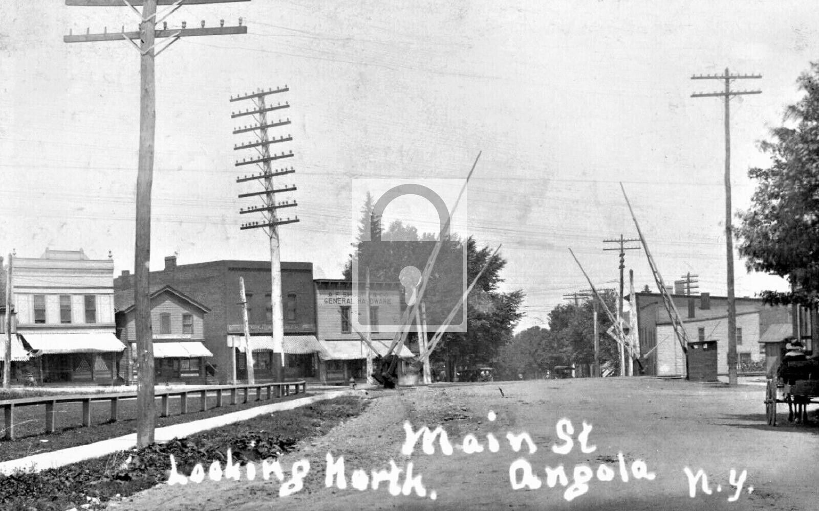 Main Street View Railroad Crossing Angola New York NY Reprint Postcard