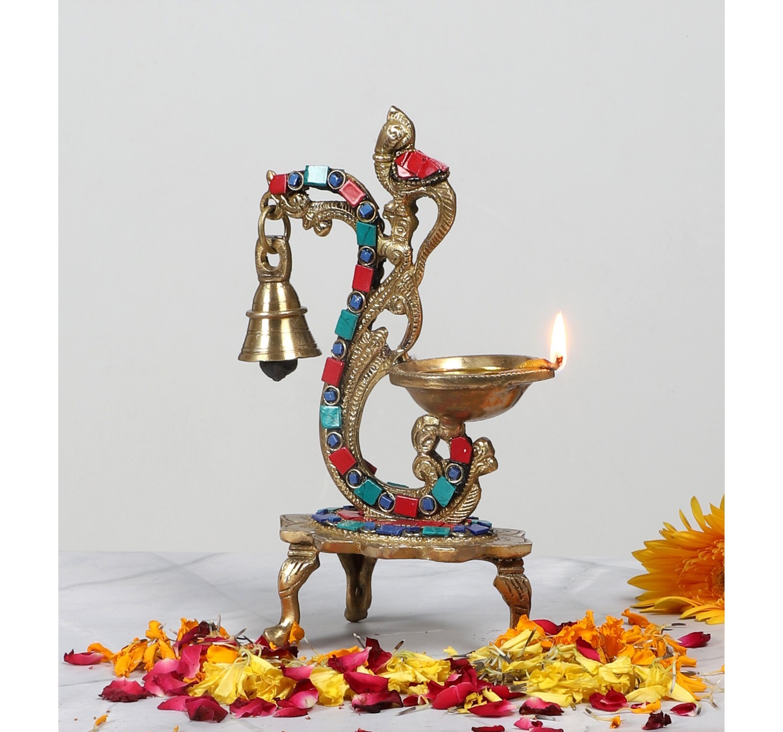 Gemstone Work Ethnic Carved Peacock Design Brass Diya with Bell Gemstone Work Ethnic Carved Peacock Design Brass Diya with Bell