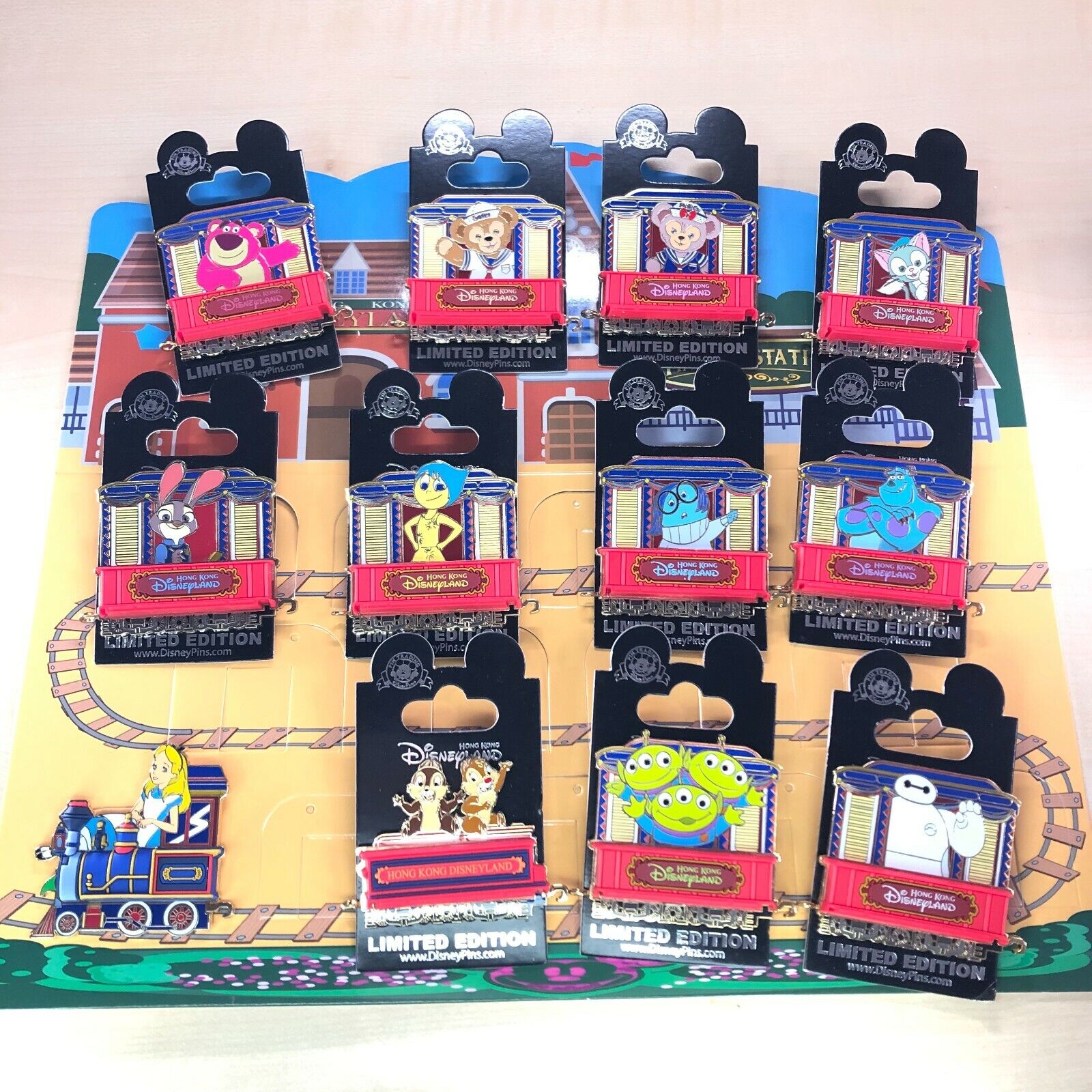 HKDL Train Series LE 300 pin set Zootopai Toystory Alice InsideOut Baymax CnD