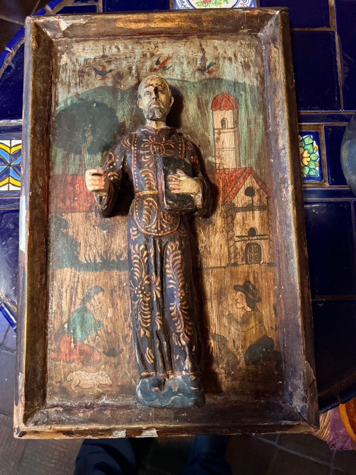 antique santos hand carved woodSaint Francis of Paola relief on painting
