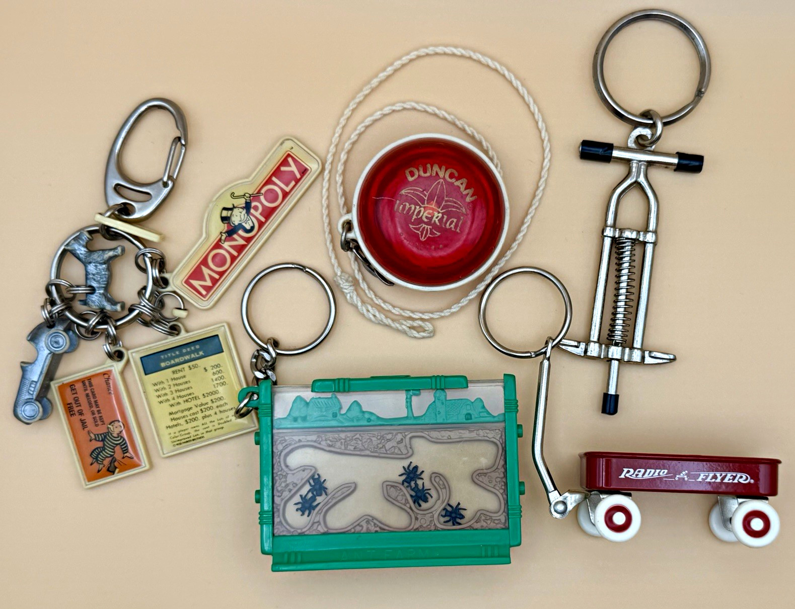 Vintage Novelty Keychains Lot of 4 Monopoly Radio Flyer Ant Farm Duncan Yo-Yo
