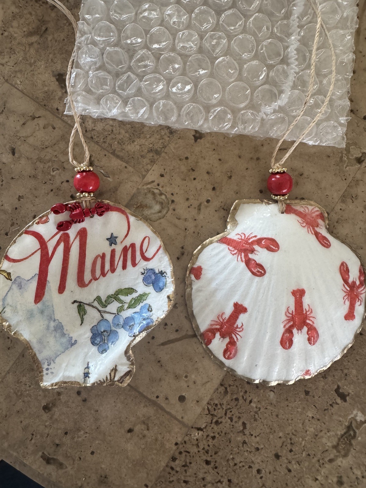 Decoupaged set of two seashell Ornaments with State of Maine and Lobsters Decoupaged set of two seashell Ornaments with State of Maine and Lobsters