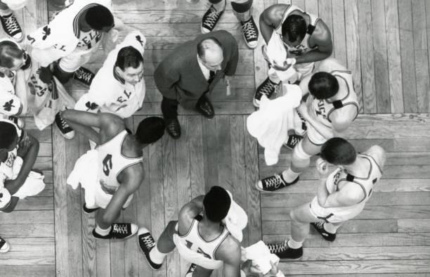 Overhead view head coach Red Auerbach of Boston Celtics talks play- Old Photo