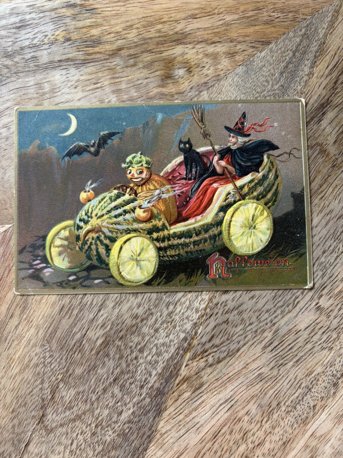 ANTIQUE  TUCK'S BLACK CAT AND WITCH IN WATERMELON CAR HALLOWEEN POSTCARD