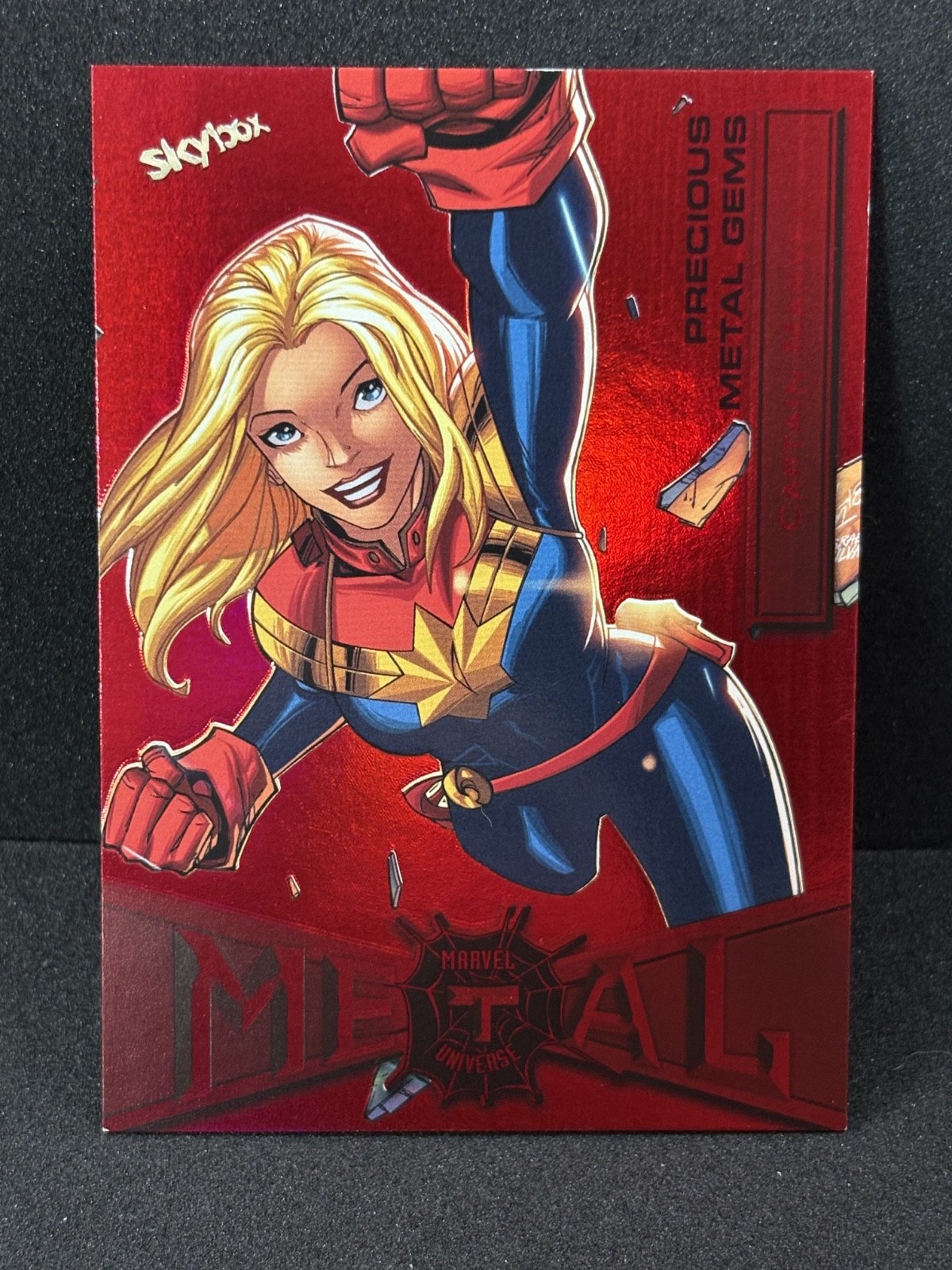 2022 Upper Deck Metal Universe Spider-Man PMG Red #17 Captain Marvel 81/100