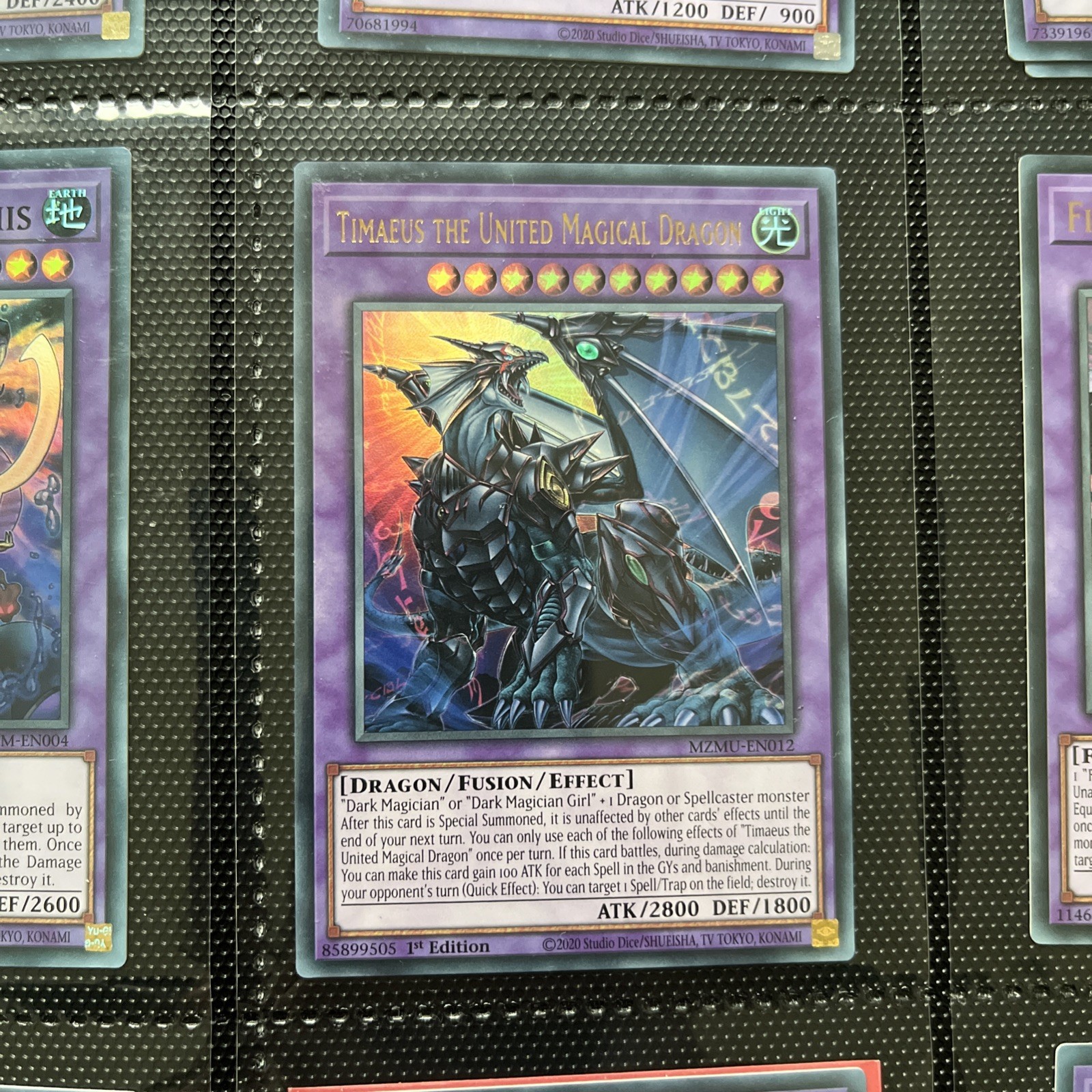 MZMU-EN012 Timaeus the United Magical Dragon Ultra Rare 1st Edition YuGiOh