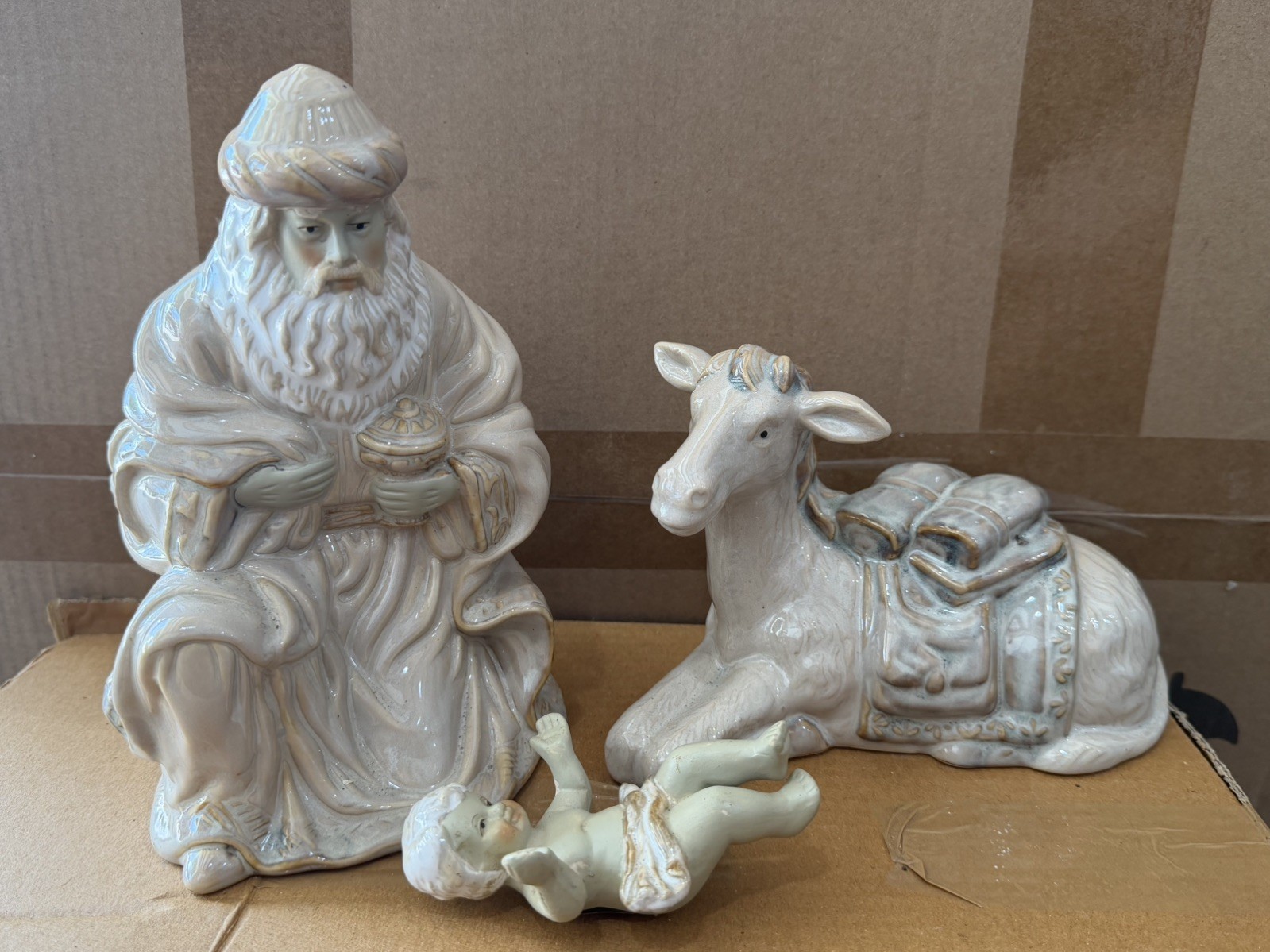 Wise man holding gift   glazed ceramic