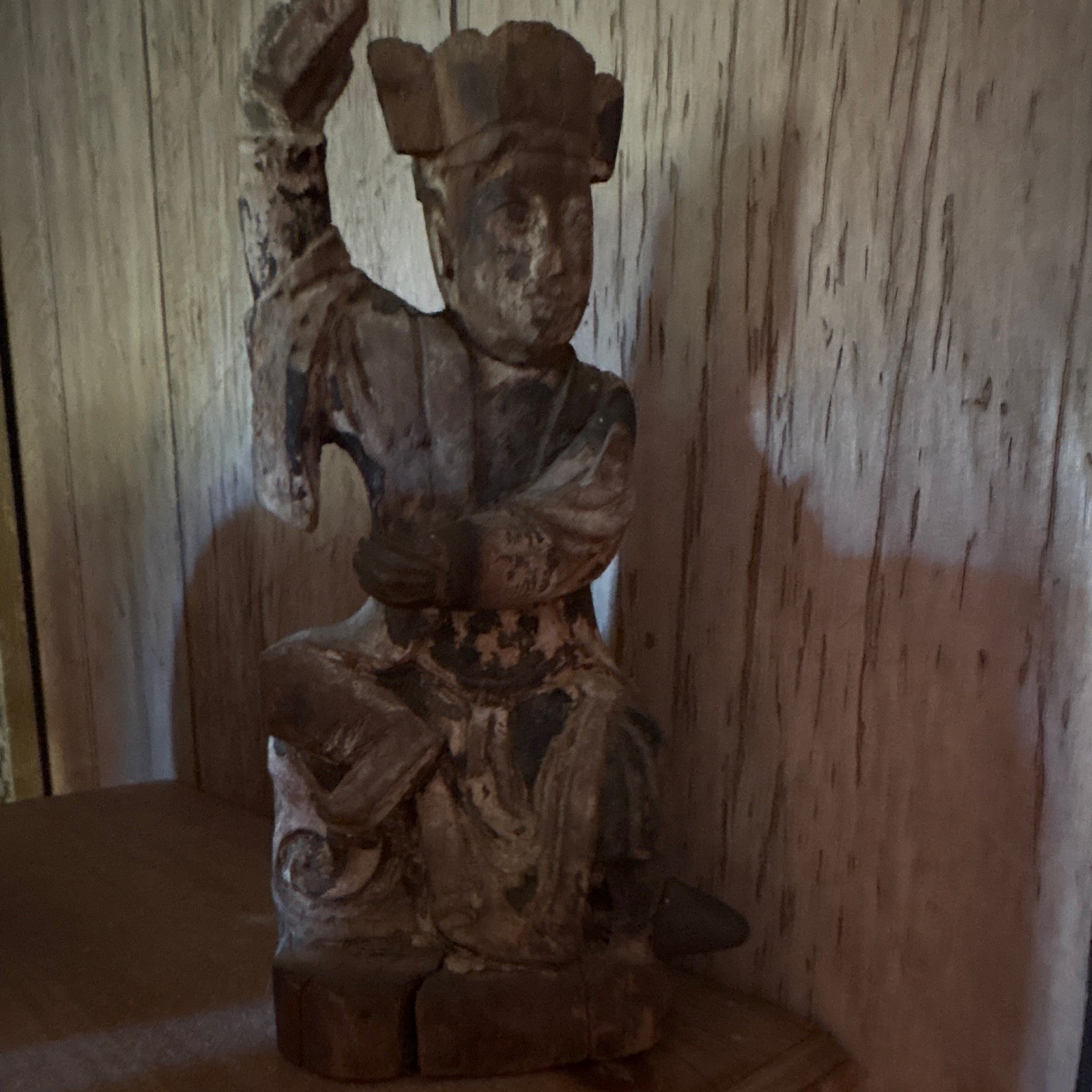 An antique carved wooden Chinese Taoist or folk religion figure