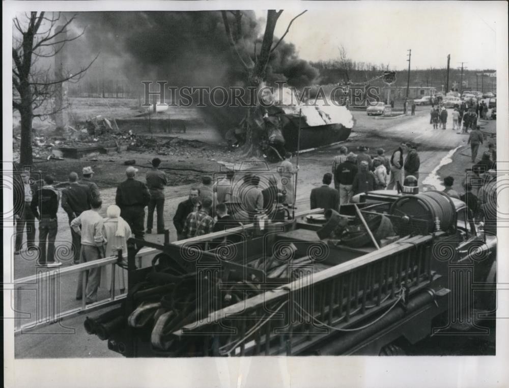 1956 Press Photo Gentryville, Indiana: Onlookers view the flaming remains of an