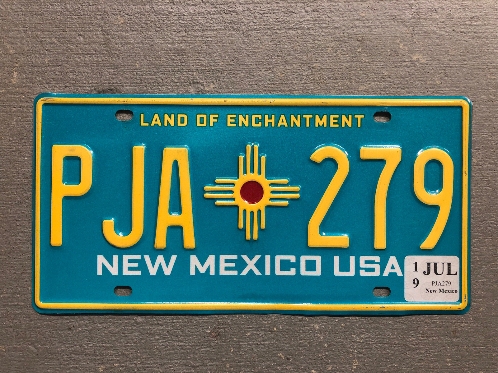 NEW MEXICO LICENSE PLATE TURQUOISE LAND OF ENCHANTMENT RANDOM LETTERS/NUMBERS