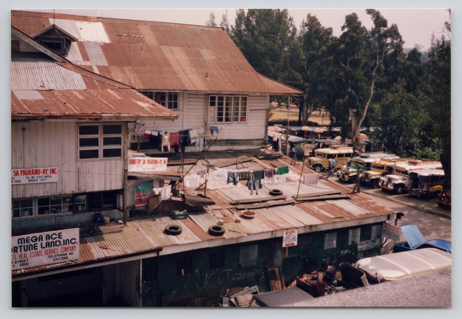 Vintage Photo Baguio Philippines Street Scene and Home Clothes and Tires on Roof