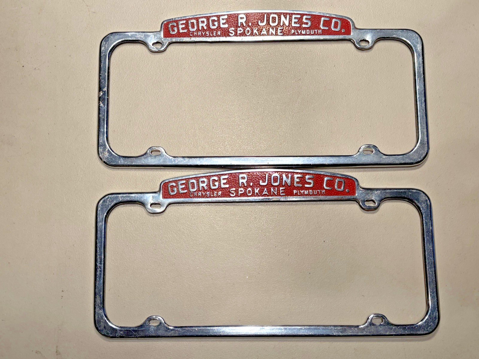 Pair Vtg. SPOKANE GEORGE R. JONES CO. CHRYSLER PLYMOUTH License Plate Holders
