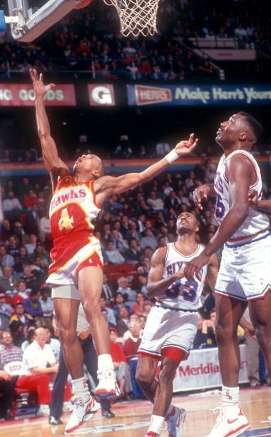 Spud Webb Atlanta Hawks goes for the lay-up as Hersey Hawkins and - Old Photo