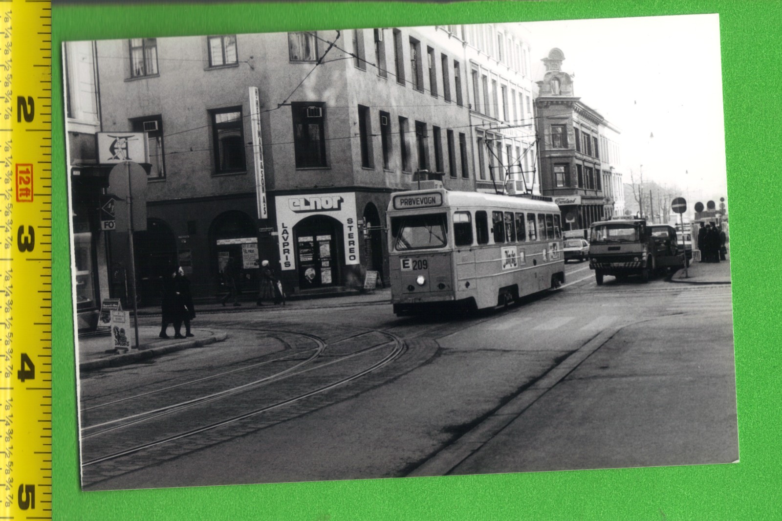 Vintage Snapshot Photo – Oslo Norway Tram on Urban Street with Shops (1980s)