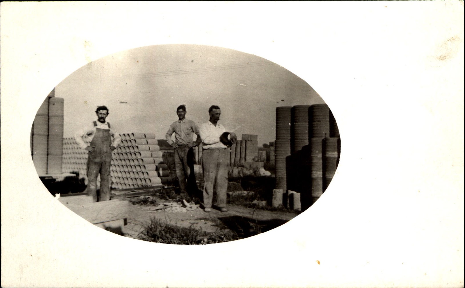 RPPC real photo ~ construction workers with pipe sections ~ AZO 1904-1918 RPPC real photo ~ construction workers with pipe sections ~ AZO 1904-1918
