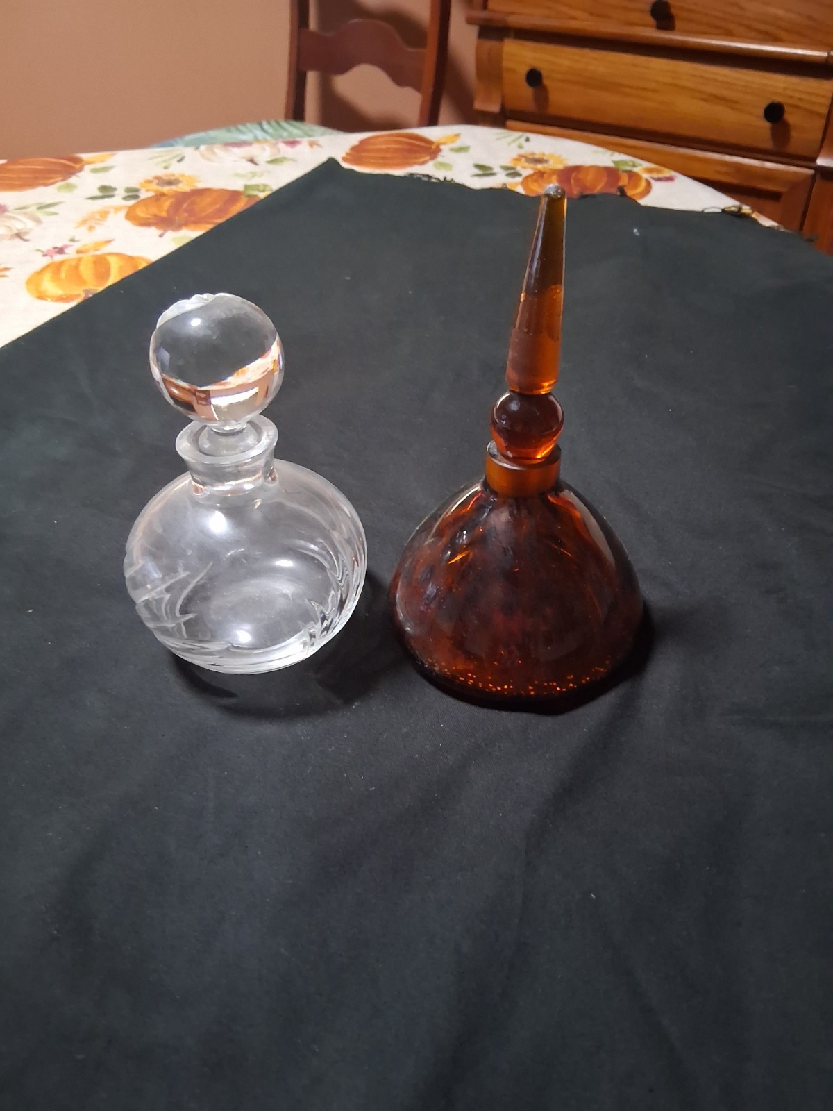 Two beautiful perfume bottles 1 Amber and 1 victorian 