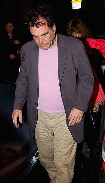 Alexander director Oliver Stone enters Renards nightclub while on - Old Photo