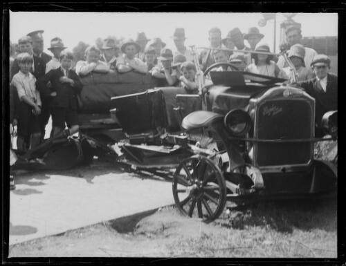 People standing around a broken car outside a Mobil oil garage - 1930s Old Photo